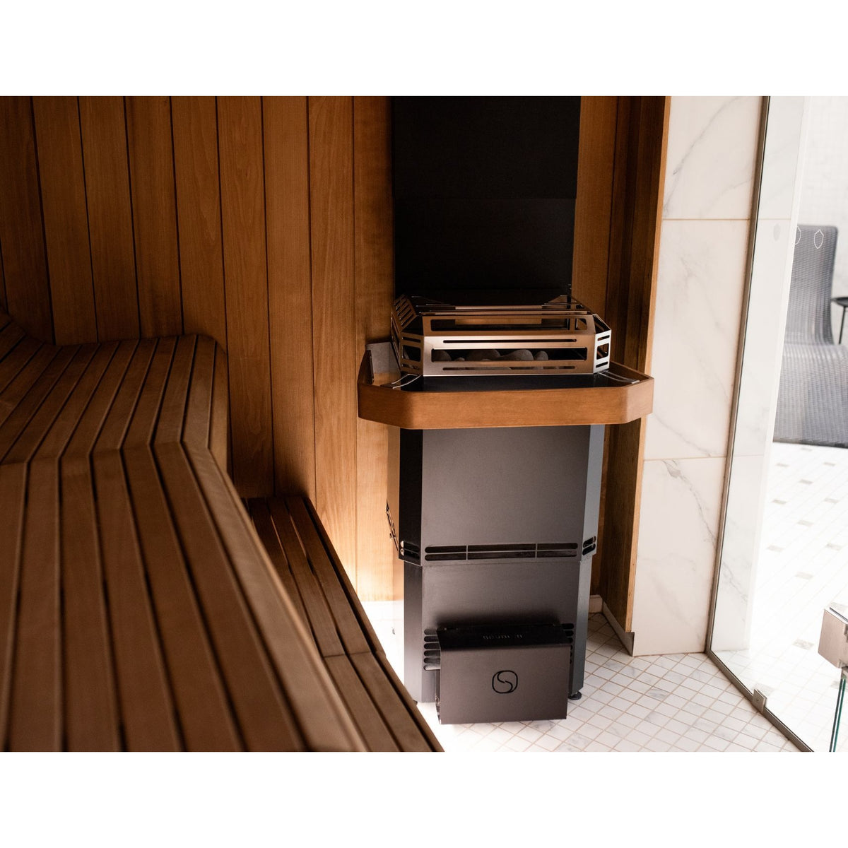 Saunum Air L heater with the safety rail in a sauna (heater sold separately)