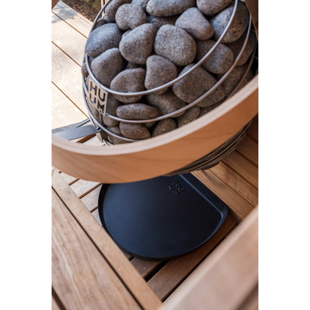 HUUM drip tray in place under a HUUM DROP sauna heater (heater sold separately)