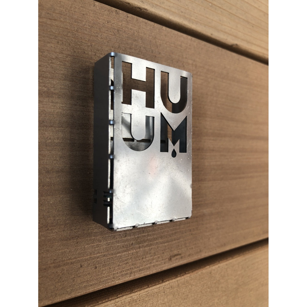 HUUM UKU temperature sensor mounted on a sauna wall